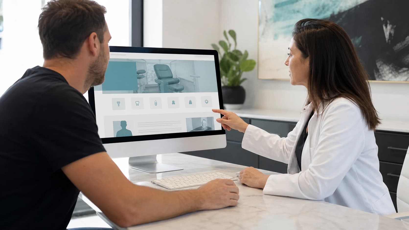 Dental practice owner reviewing treatment and dentist website content