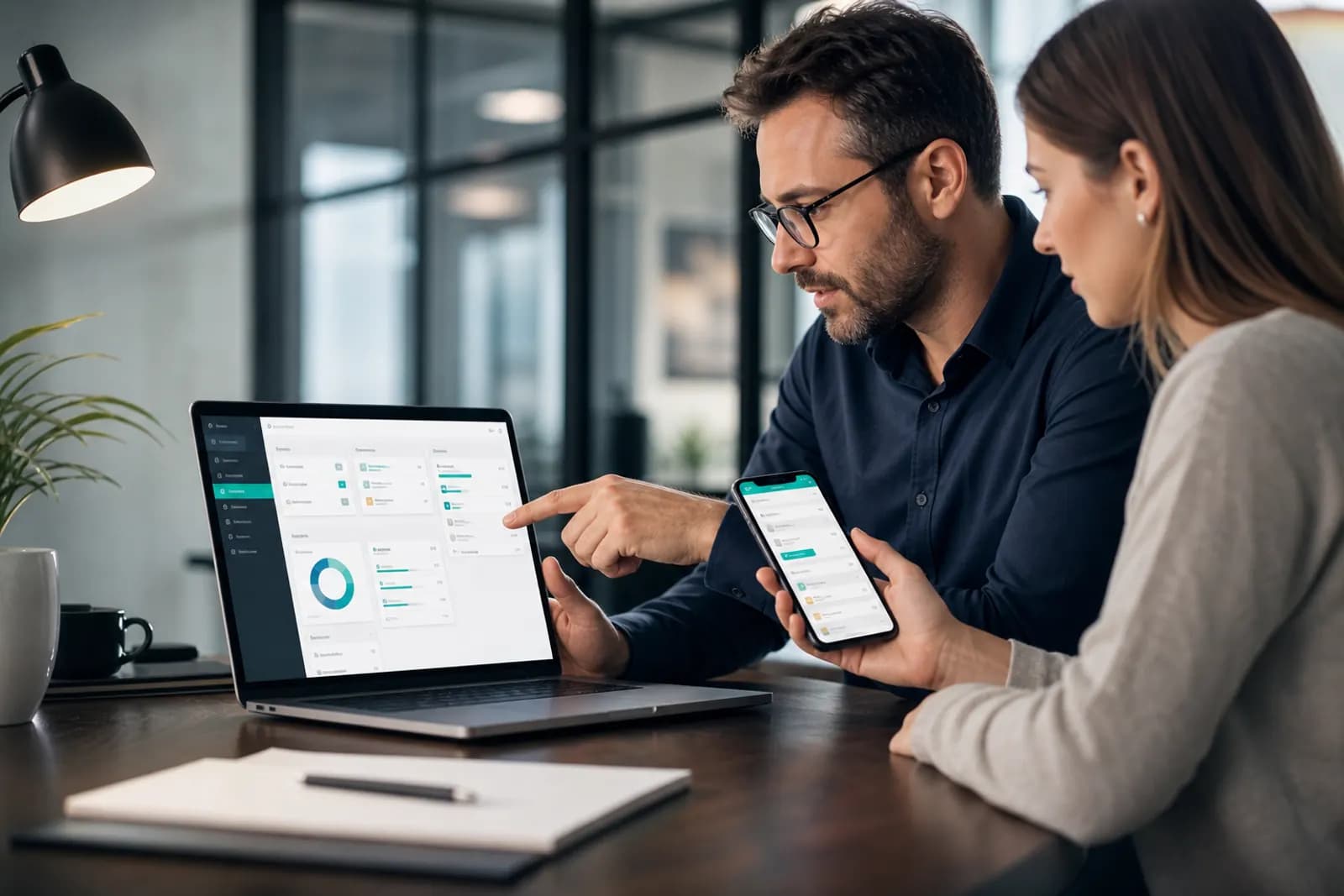 Consultant testing a responsive secure client portal on laptop and mobile